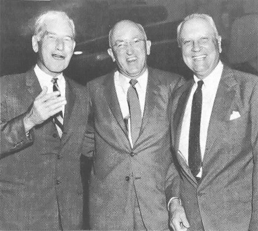 At the Boeing 50th: Juan Trippe, Pan Am's Board Chairman (right) and Boeing President William Allen (center) with Crawford H. Greenewalt, Director and Chairman of the Board of the E. I. DuPont de Nemours Co. and a member of the Board of Directors of the Boeing Company (left).