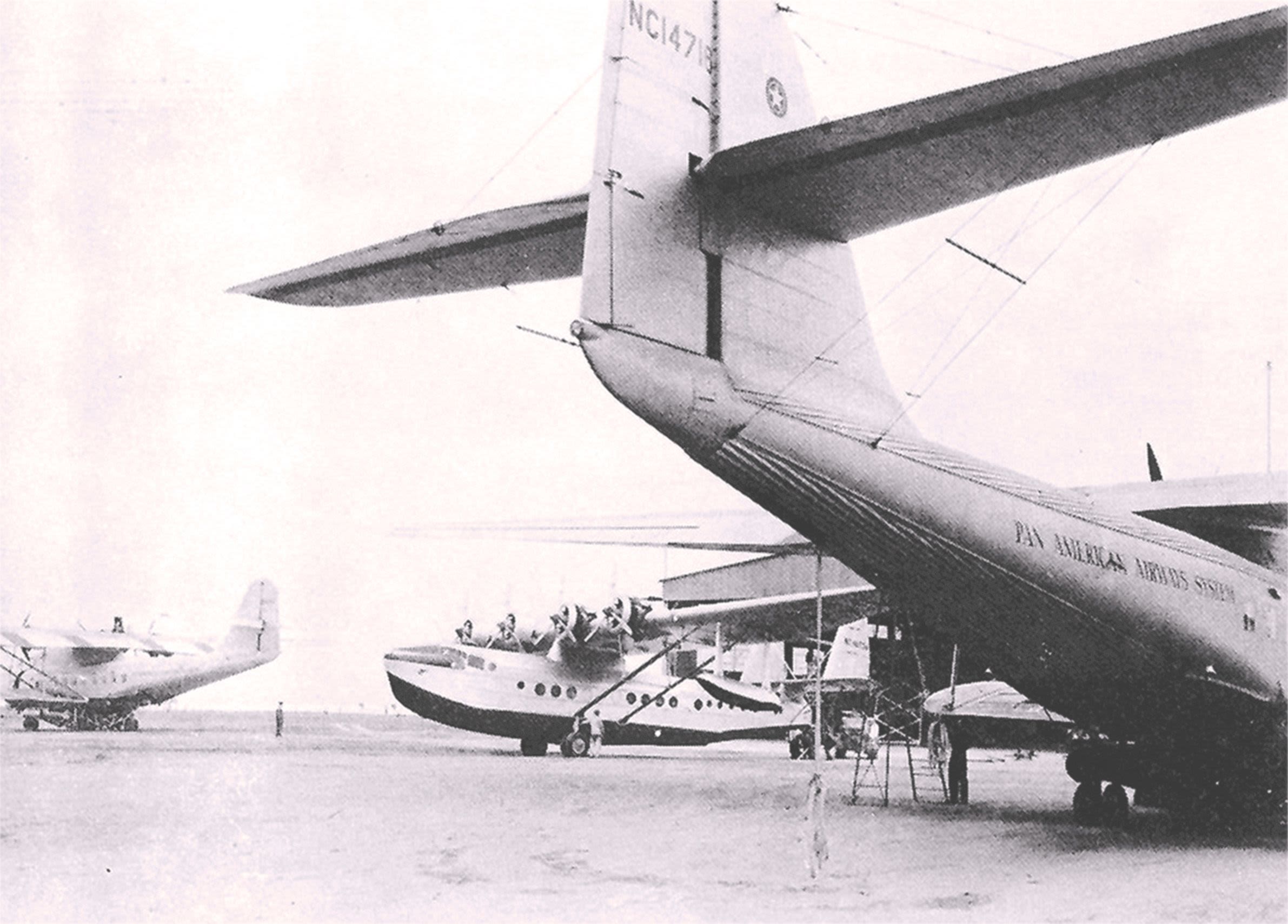 Pan Am flying boats ready for maintenance, a Sikorsky S-42 and two Martin M-130s.